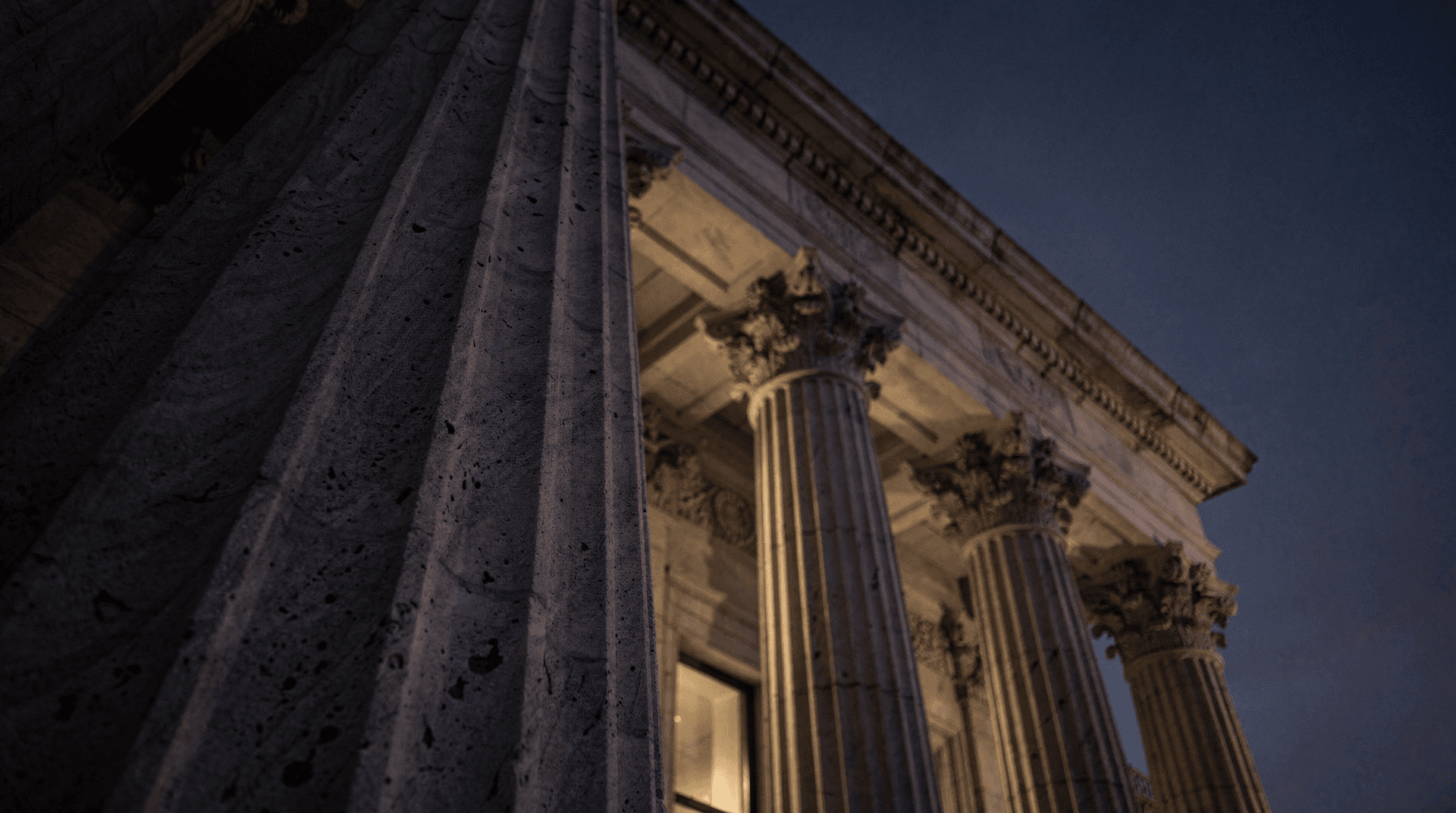 Federal Reserve building exterior at dusk with classical columns