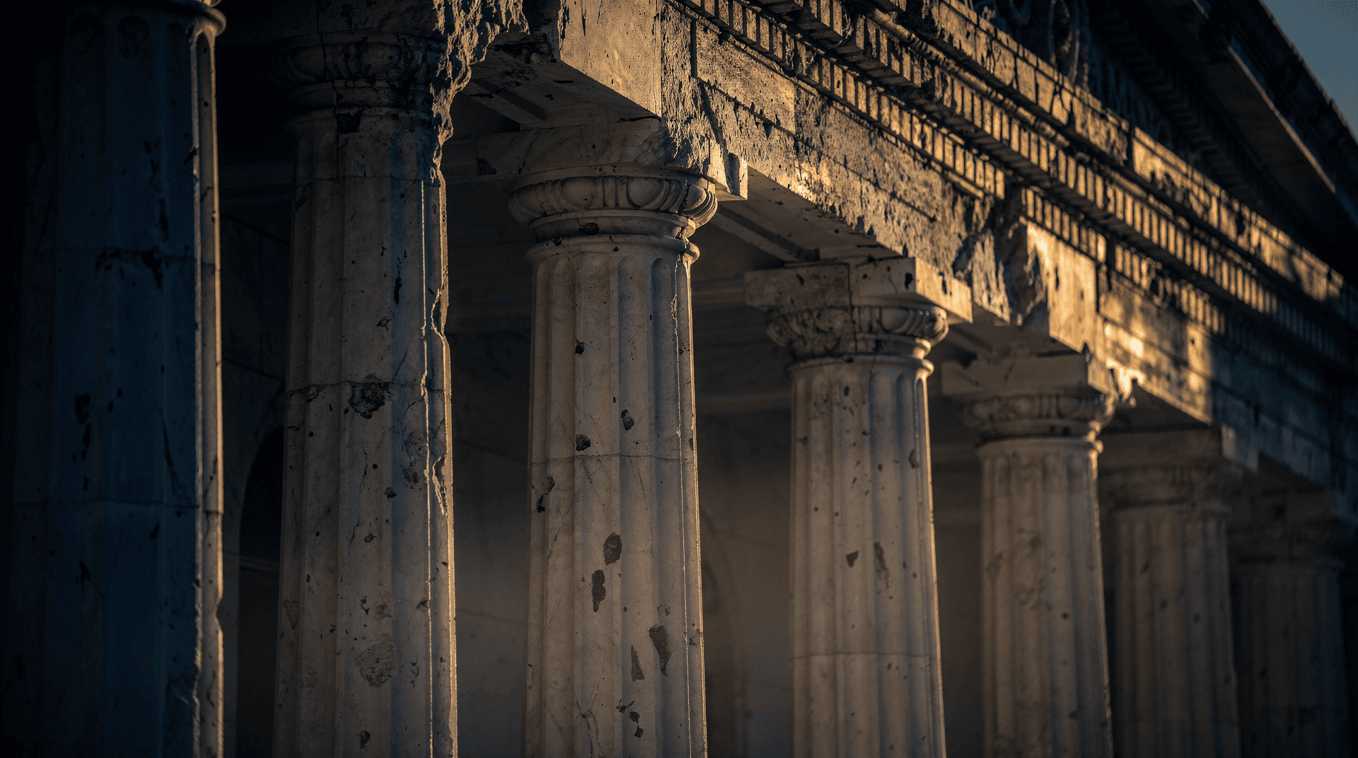 Federal Reserve building facade at dawn with light across marble columns