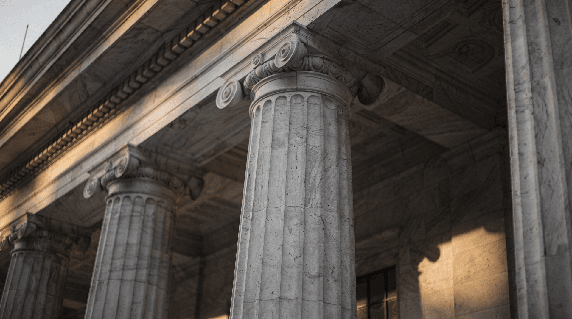 Federal Reserve building exterior with classical marble columns in dramatic light