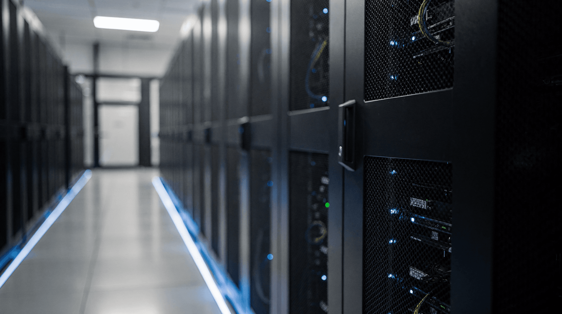 Data center server rack aisle with blue ambient lighting