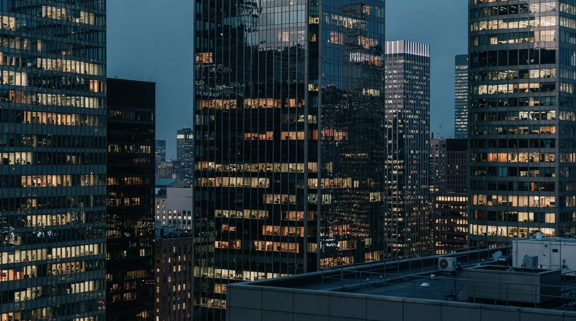 Financial district skyline at dusk with abstract glass reflections