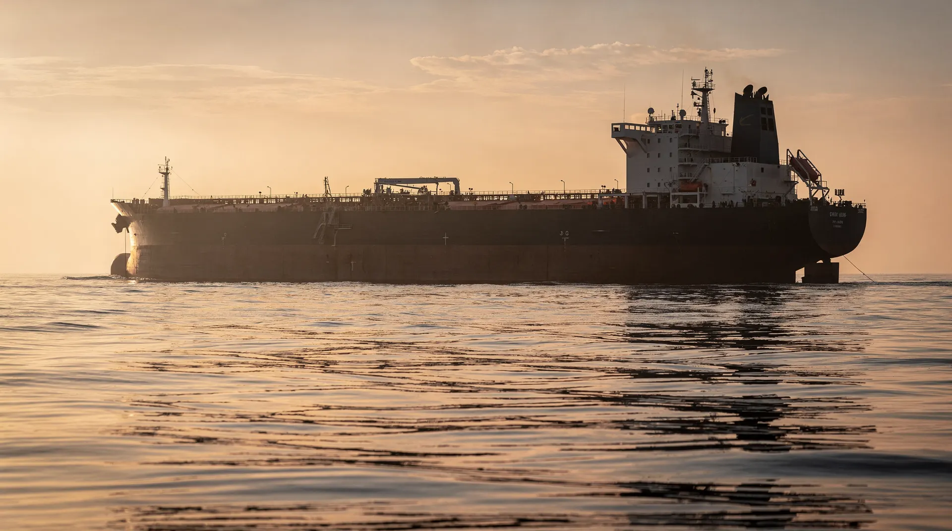 Oil tanker silhouette at sea at dusk